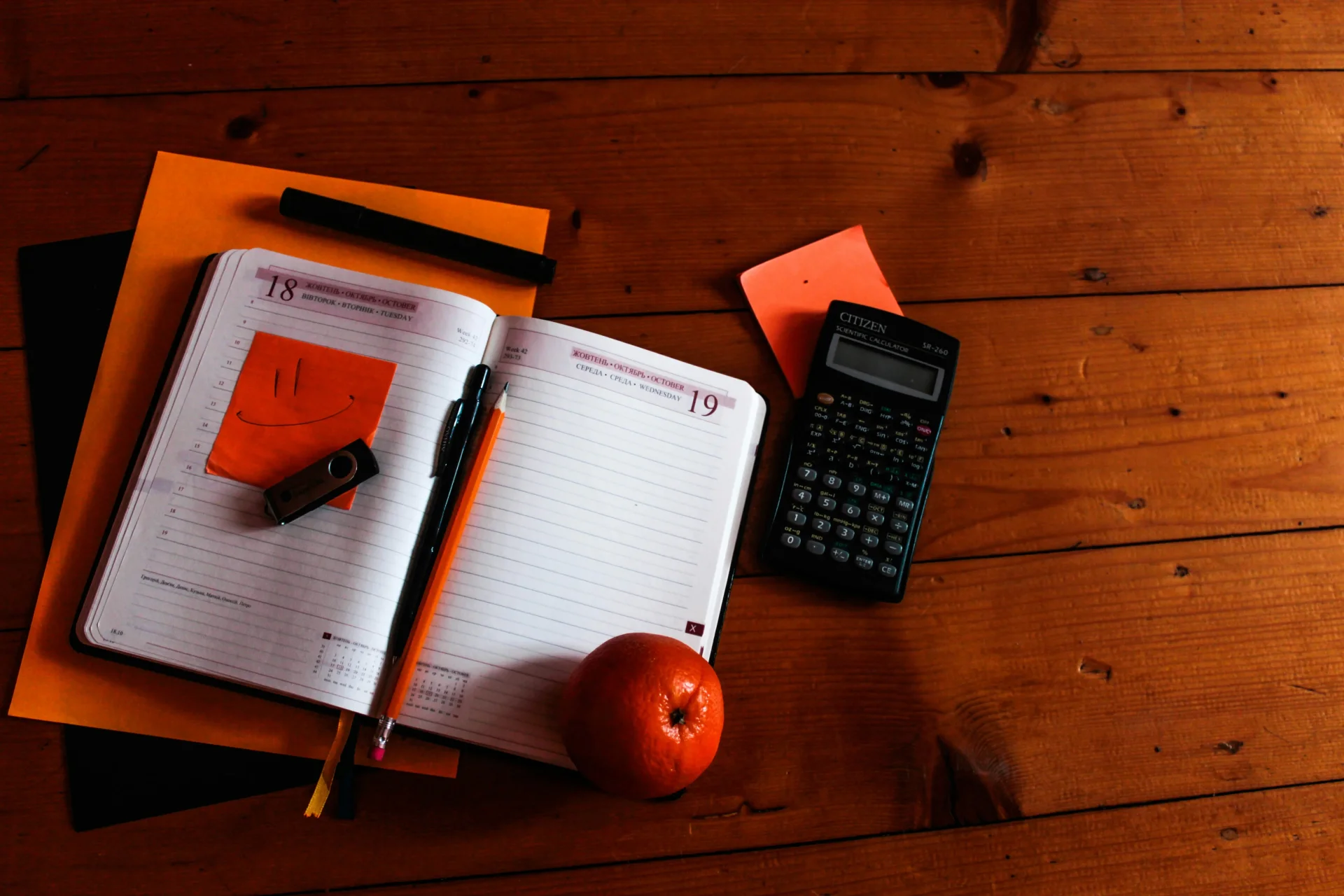 Student working with calculator and documents